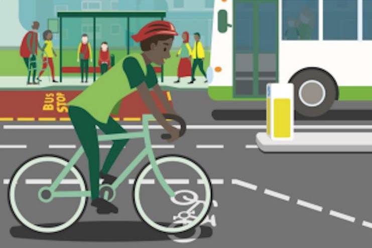 A graphic of a man on a bike, people in the background and the front of a bus