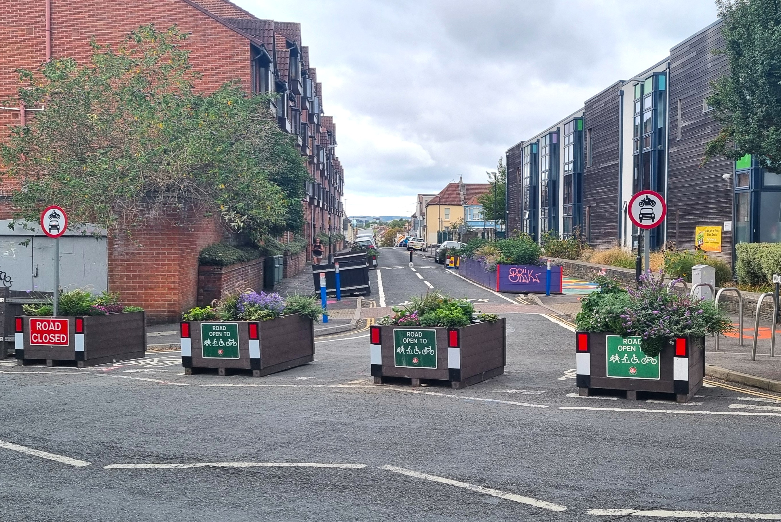 Illustrative image showing a modal filter outside a school. This is fully described in the text above.