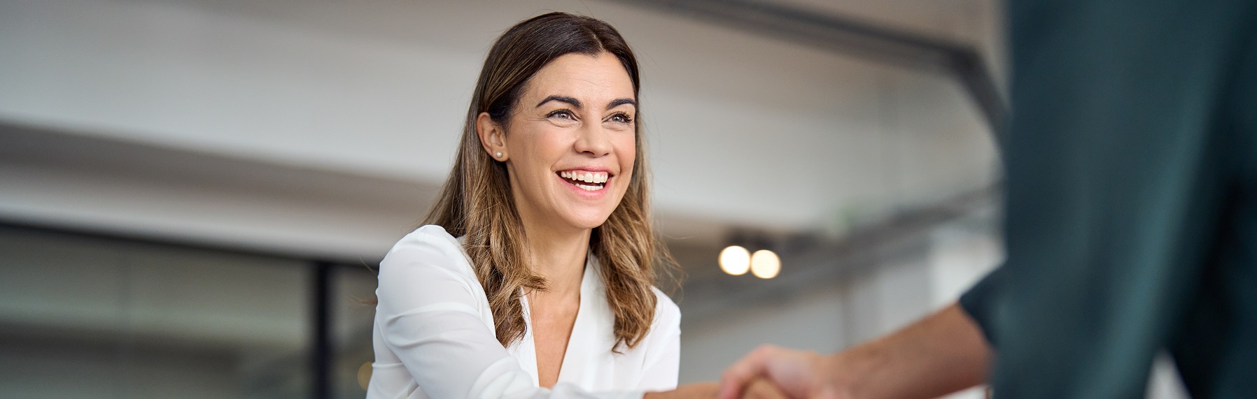 Woman shaking hands with another person