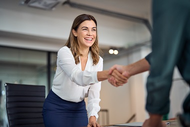 Woman shaking hands with another person