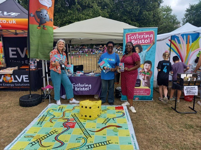 People smiling at an outside event